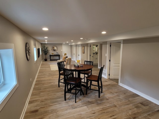 dining space with light wood-type flooring