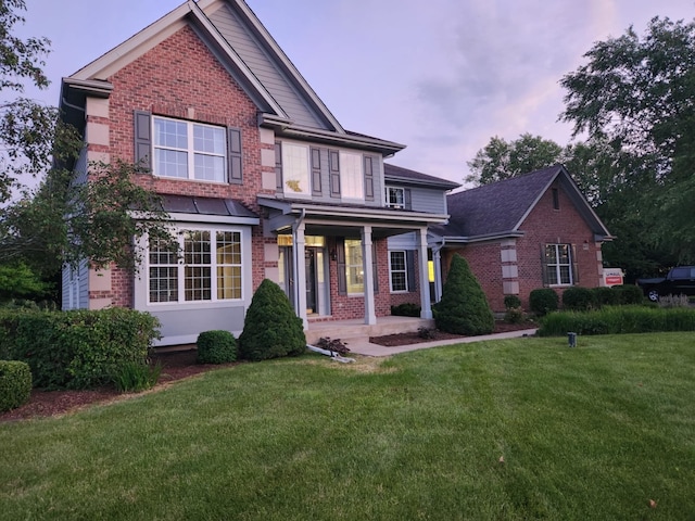 view of front of property with a yard