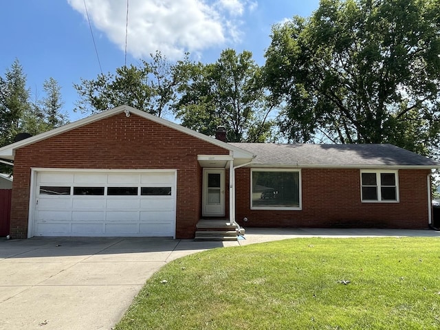 single story home with brick siding, a chimney, concrete driveway, an attached garage, and a front lawn