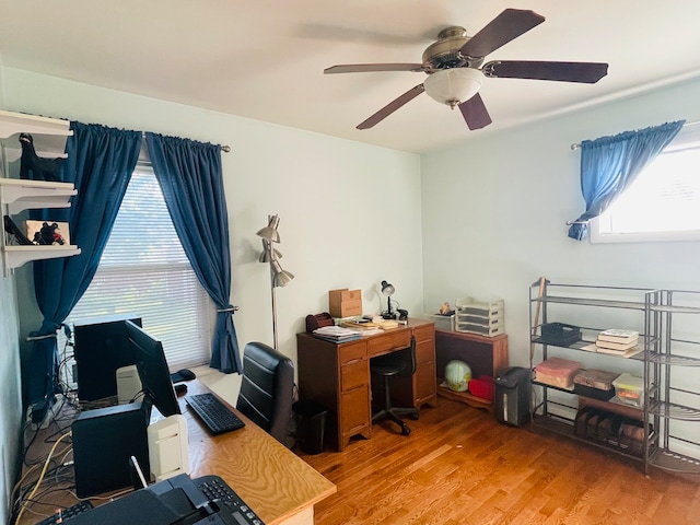 office area with wood-type flooring and ceiling fan