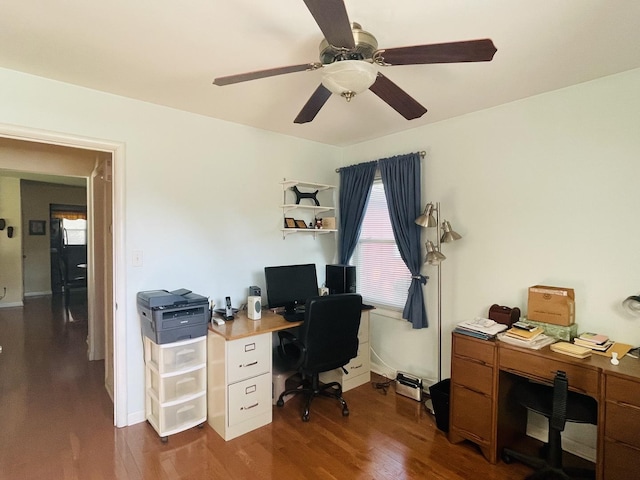 office featuring baseboards, a ceiling fan, and wood finished floors