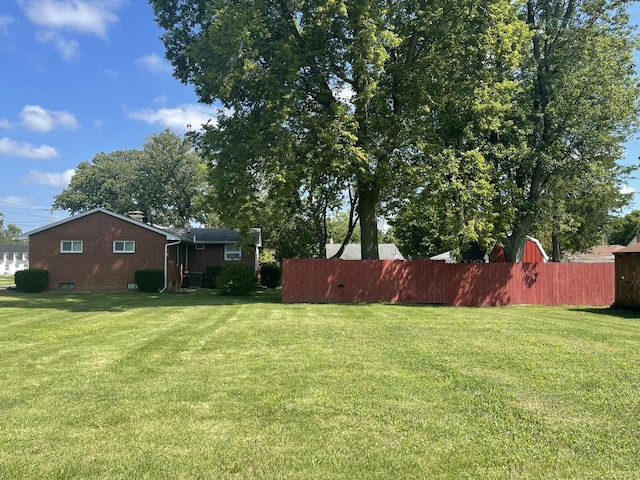 view of yard with fence