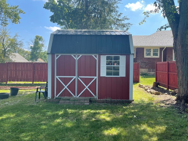 view of outdoor structure with a lawn