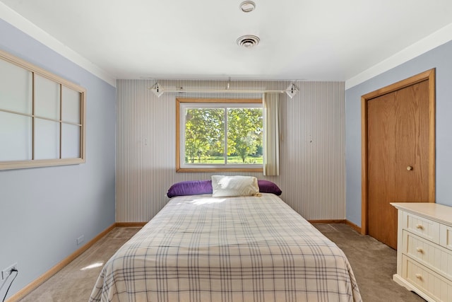 bedroom with light colored carpet