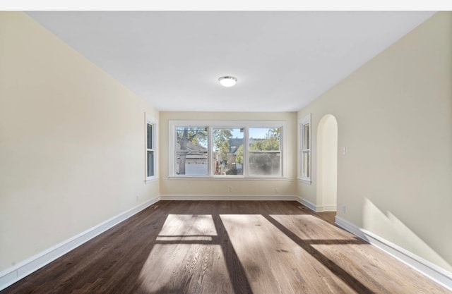 spare room featuring dark hardwood / wood-style floors