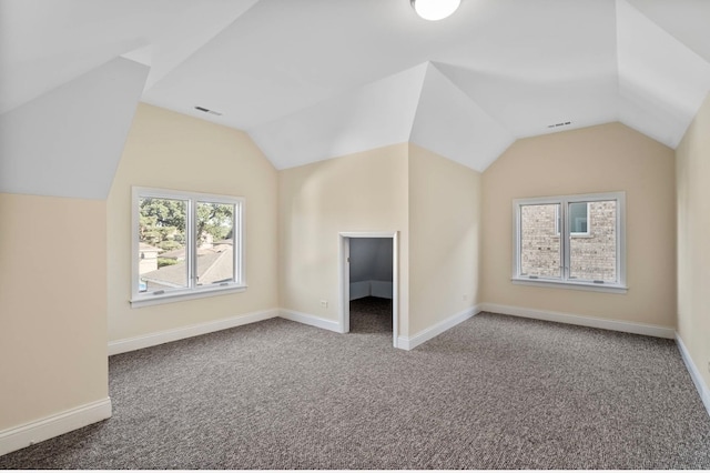 bonus room featuring lofted ceiling and carpet