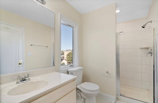 bathroom with an enclosed shower, tile patterned floors, toilet, and vanity