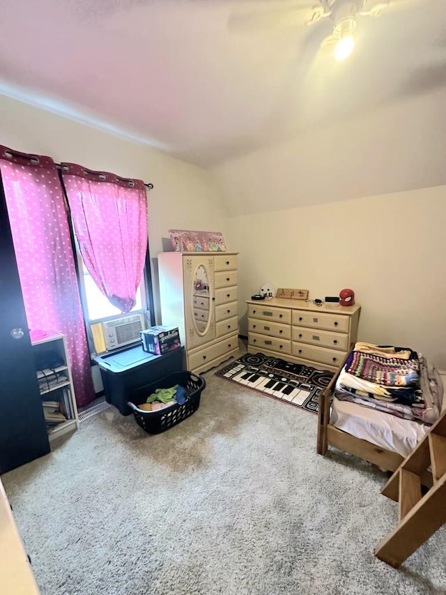 carpeted bedroom with cooling unit and vaulted ceiling