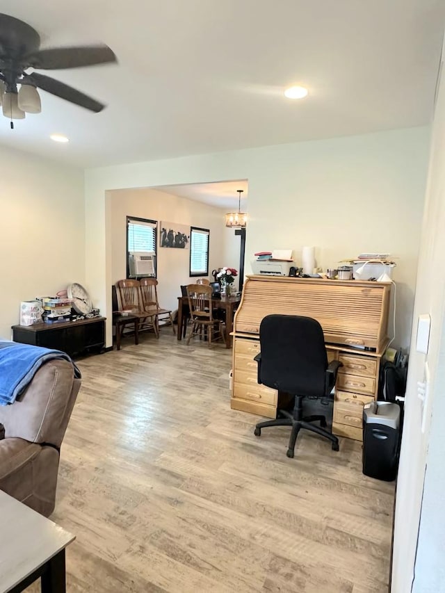 office area with light wood finished floors, recessed lighting, cooling unit, and ceiling fan with notable chandelier