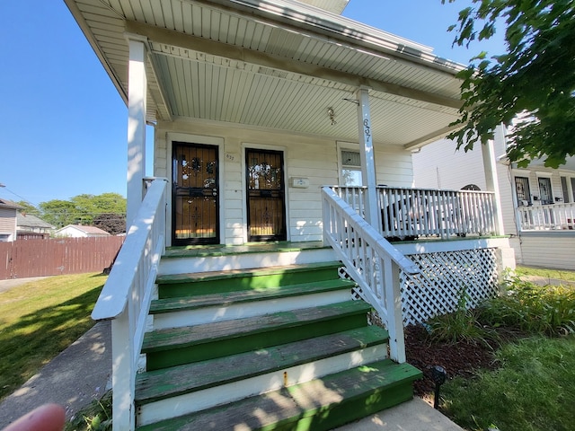 property entrance with covered porch