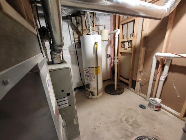 utility room featuring water heater