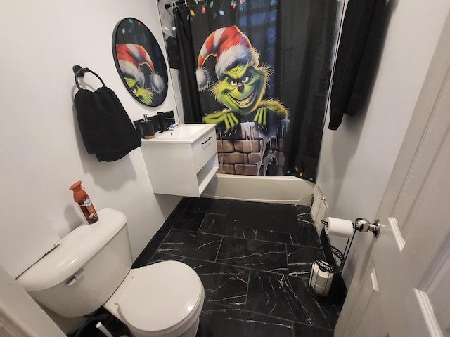 bathroom with vanity, toilet, and marble finish floor