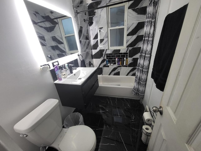 bathroom with marble finish floor, toilet, walk in shower, and vanity