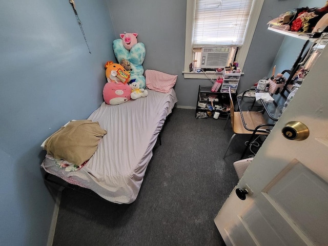 bedroom with cooling unit and baseboards