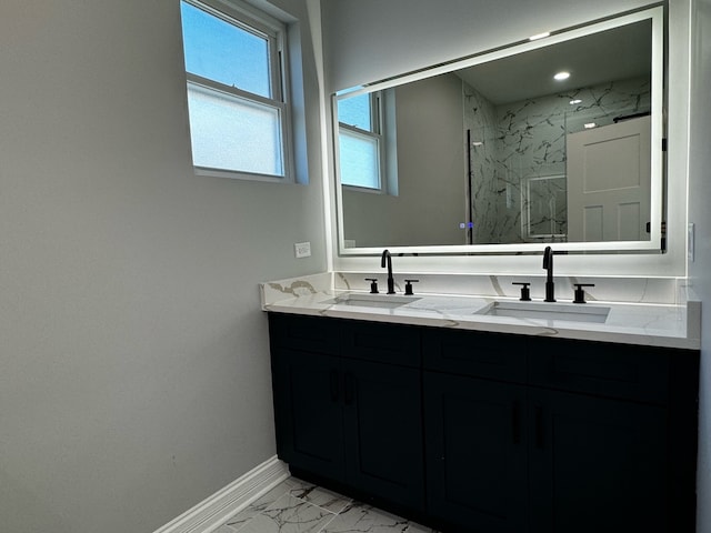 bathroom featuring vanity and a shower with shower door