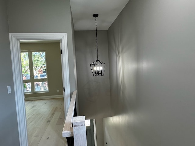 interior space with a chandelier and hardwood / wood-style flooring