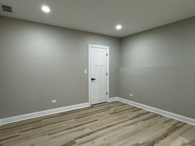 unfurnished room featuring hardwood / wood-style flooring