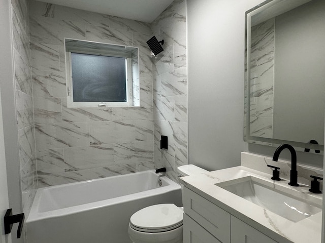 full bathroom featuring tiled shower / bath combo, vanity, and toilet