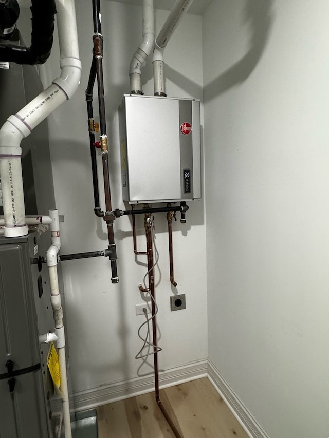 utility room with water heater