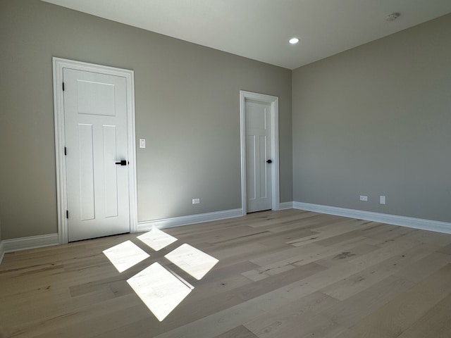 spare room featuring light wood-type flooring