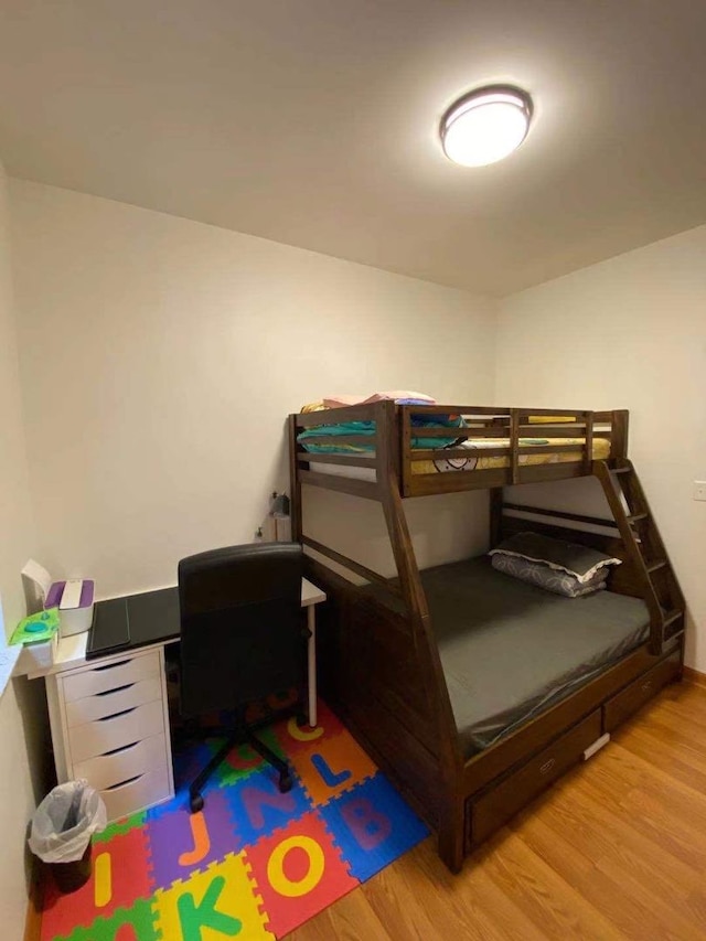 bedroom with hardwood / wood-style flooring