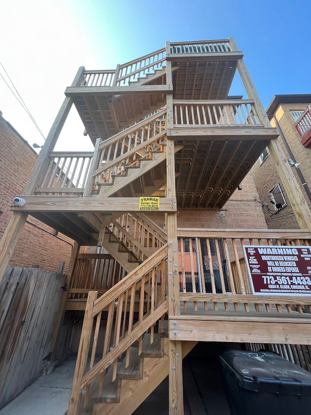 back of house featuring a wooden deck