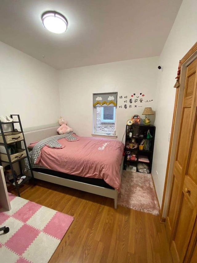 bedroom with hardwood / wood-style flooring