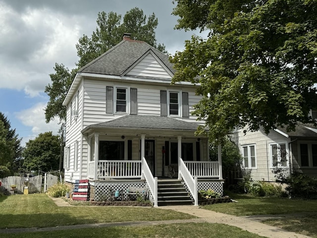 view of front of property with a shingled roof, a chimney, fence, a porch, and a front yard