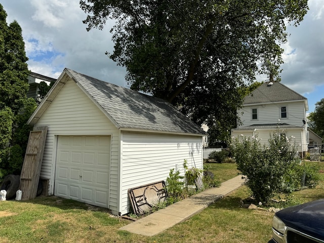 garage with a lawn