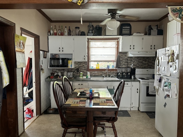 kitchen with white cabinets, white appliances, sink, and ceiling fan