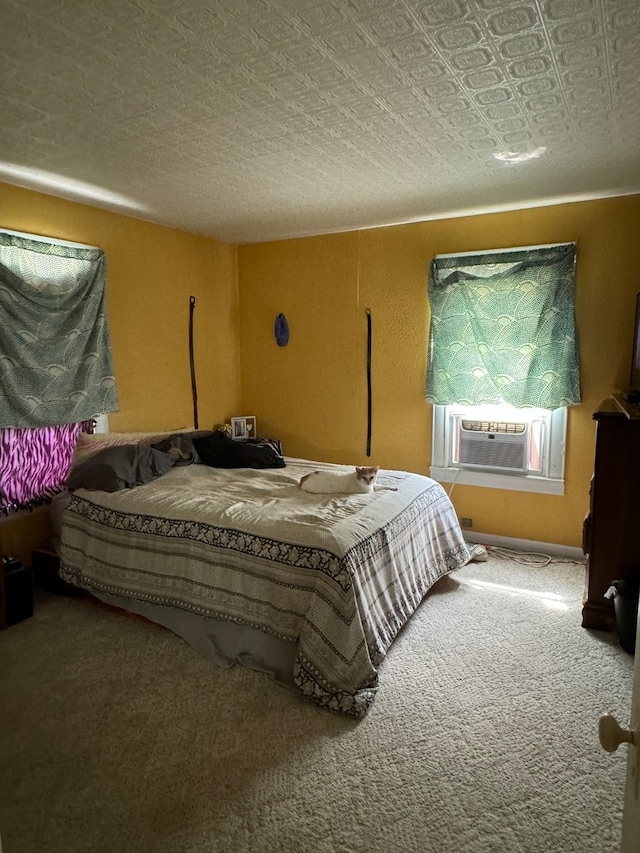 bedroom with a textured ceiling, cooling unit, and carpet floors