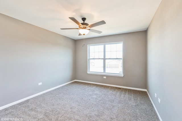 unfurnished room featuring carpet flooring and ceiling fan