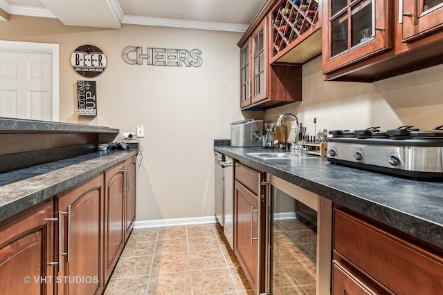 kitchen with crown molding, stainless steel stovetop, wine cooler, and sink