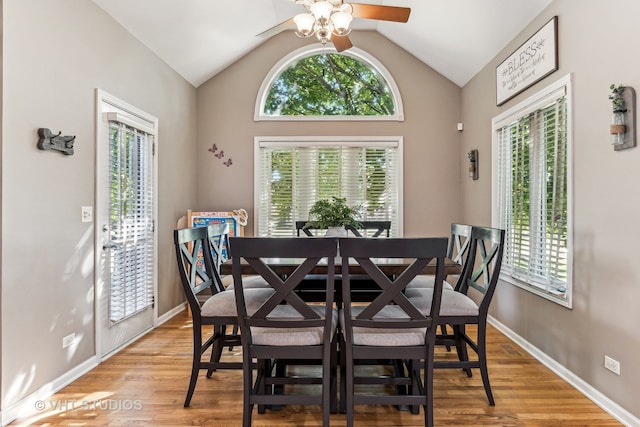 dining area featuring vaulted ceiling, a healthy amount of sunlight, ceiling fan, and light hardwood / wood-style floors