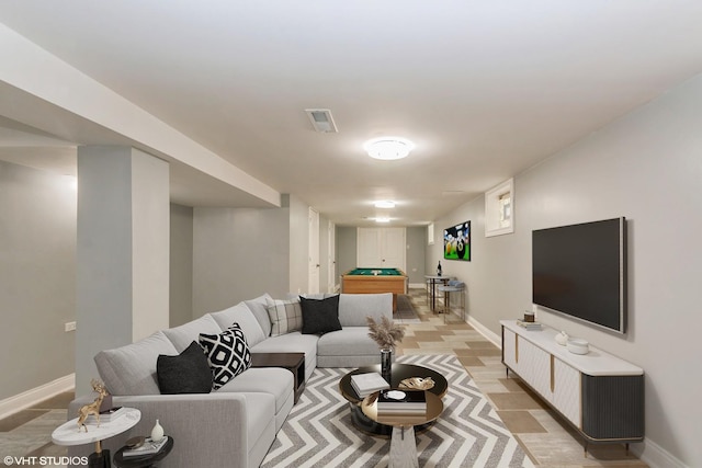 living room with light hardwood / wood-style flooring and pool table