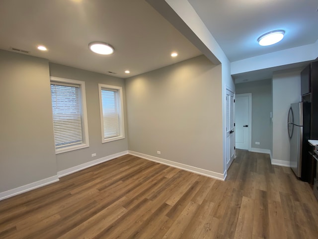 empty room featuring wood-type flooring