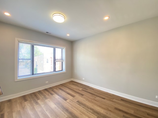 empty room featuring hardwood / wood-style flooring