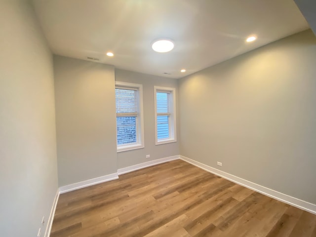 empty room featuring wood-type flooring