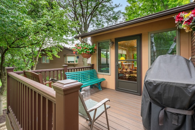 wooden deck featuring area for grilling