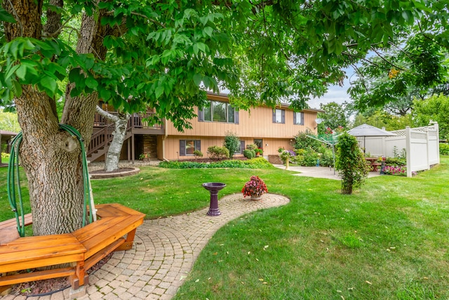 view of yard featuring a patio area and a deck