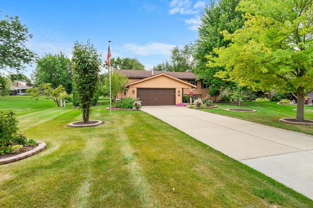 view of front facade with a front lawn and a garage