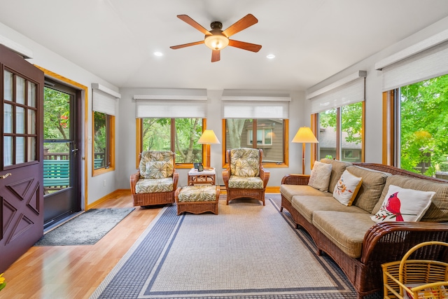 sunroom / solarium featuring ceiling fan and a wealth of natural light