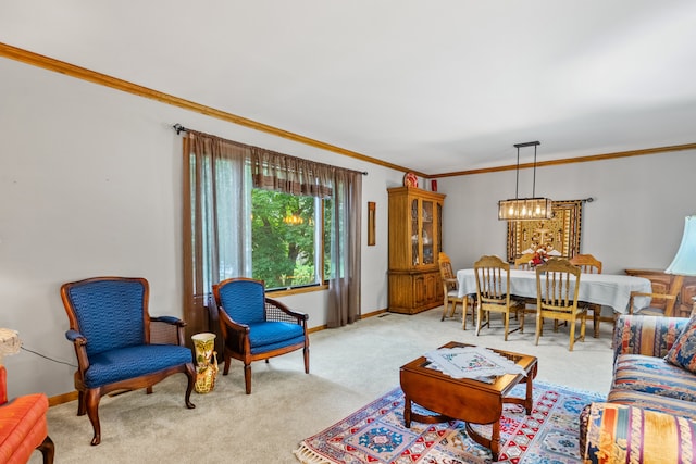 carpeted living room featuring ornamental molding and a notable chandelier