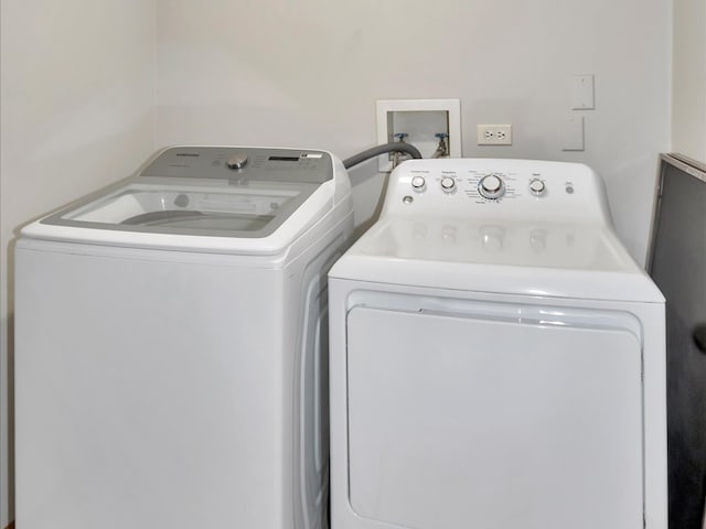 laundry area featuring separate washer and dryer