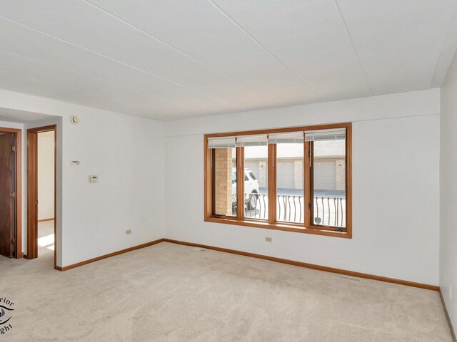 empty room with light colored carpet