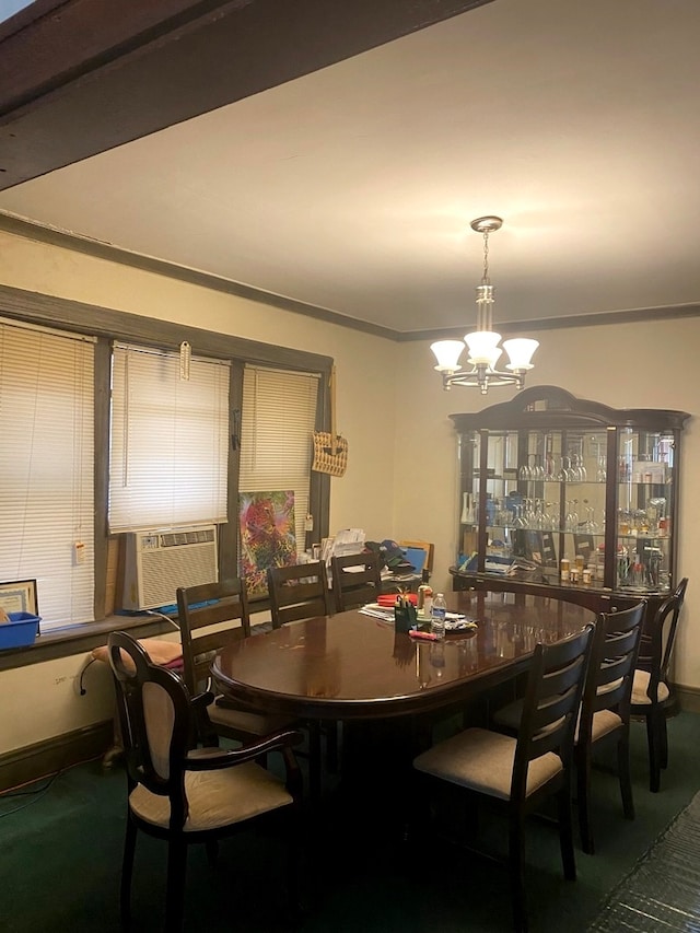 dining area with a notable chandelier, cooling unit, and carpet floors