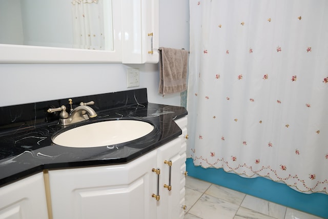 full bathroom with vanity and shower / tub combo with curtain