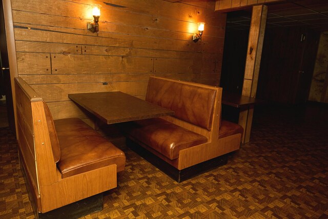 dining room with wooden walls