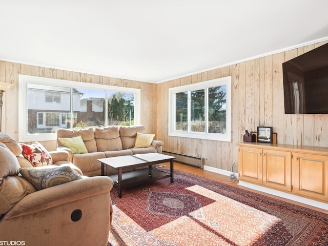 living room featuring light wood-type flooring, a baseboard radiator, and wood walls