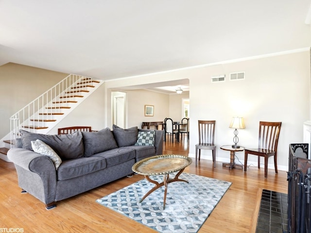 living room featuring hardwood / wood-style floors and vaulted ceiling